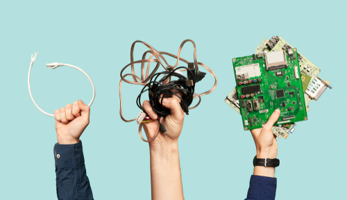 Three,Hands,Hold,Electrical,Waste,On,Blank,Blue,Background. Hands holding e-waste